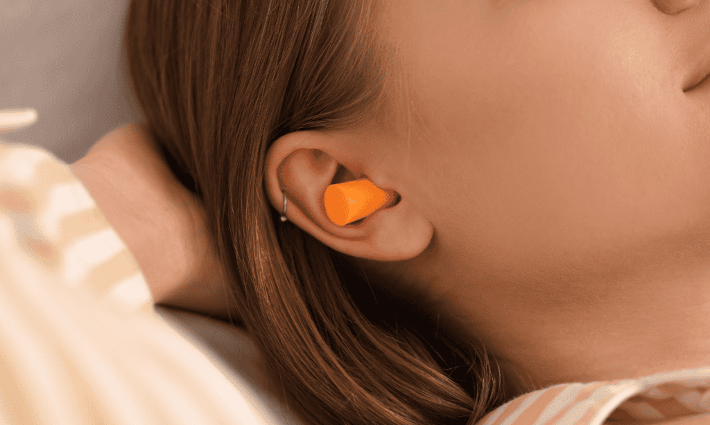 earplugs in woman