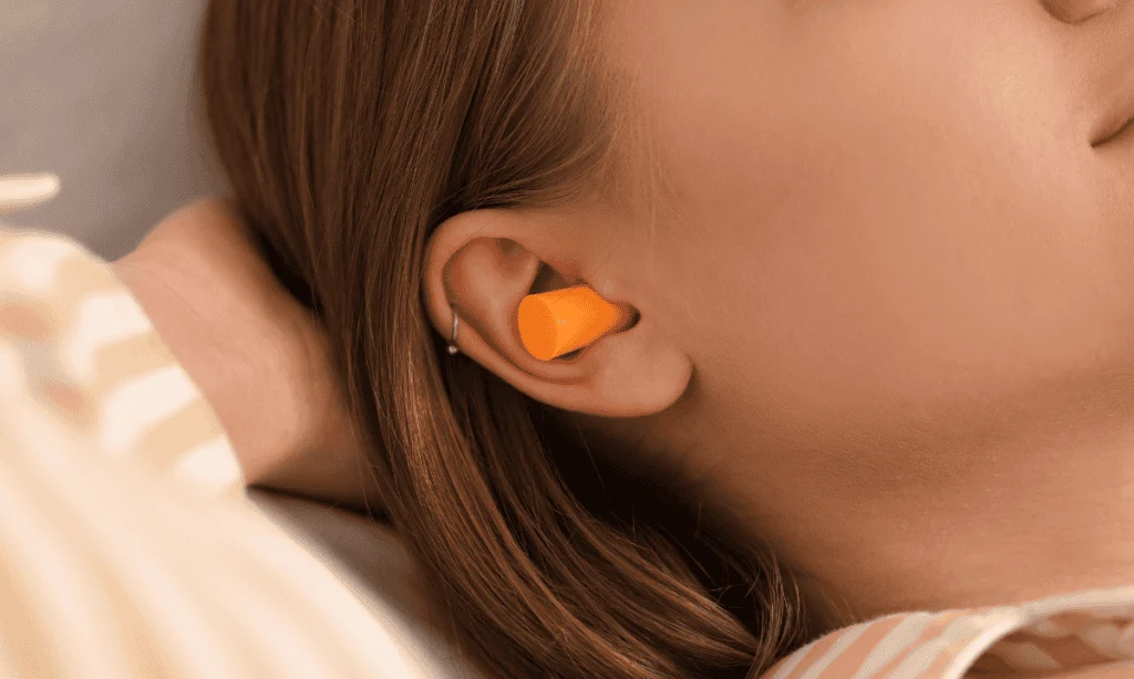 earplugs in woman